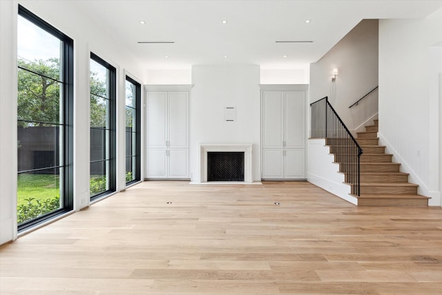 unfurnished living room featuring light hardwood / wood-style floors