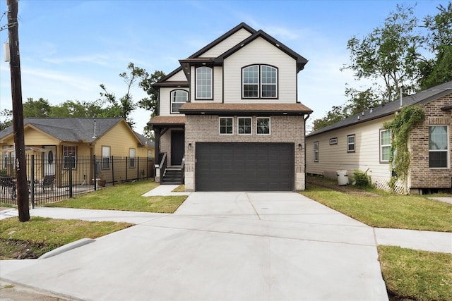 view of front of home with a garage and a front yard