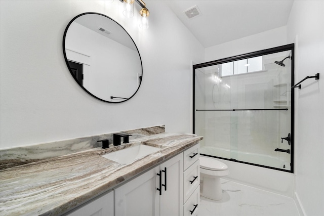 full bathroom with vanity, enclosed tub / shower combo, and toilet