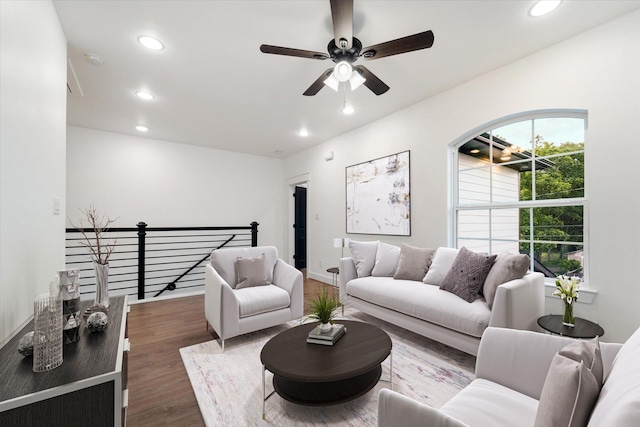 living room featuring hardwood / wood-style flooring and ceiling fan