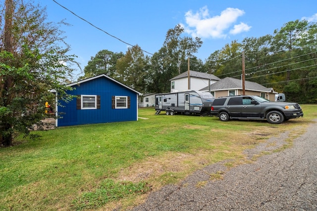 view of property exterior featuring a lawn