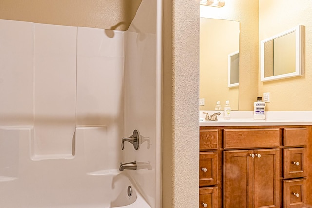 bathroom with vanity and  shower combination