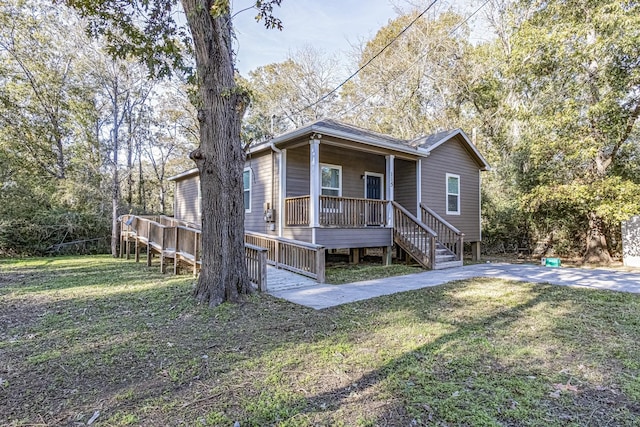 exterior space with a porch and a yard