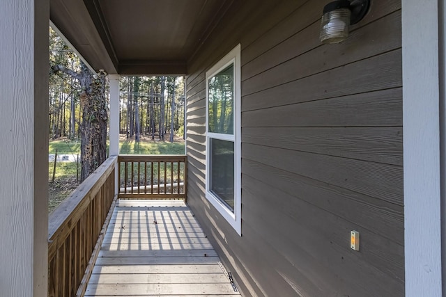 wooden terrace with a porch