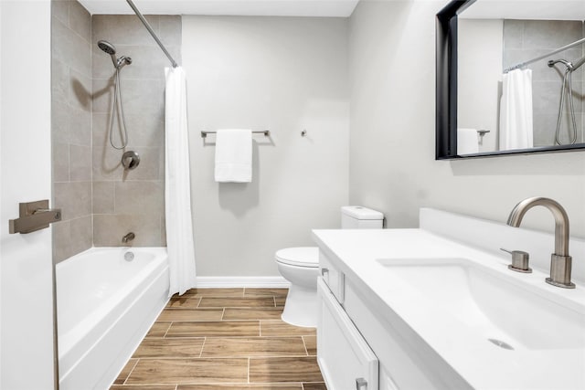 full bathroom with shower / tub combo, vanity, and toilet