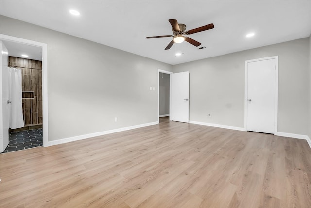 unfurnished room with ceiling fan and light hardwood / wood-style floors