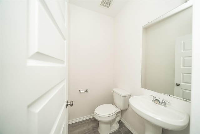 bathroom featuring sink and toilet