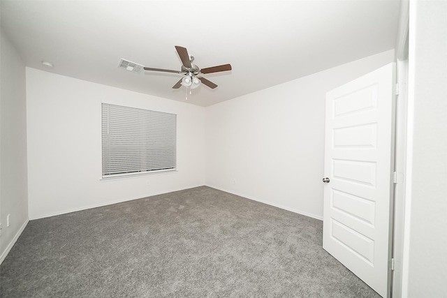 spare room with carpet and ceiling fan