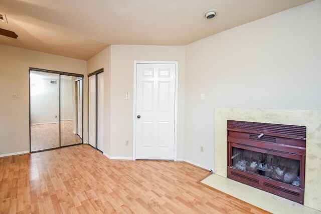 unfurnished bedroom featuring light wood-type flooring