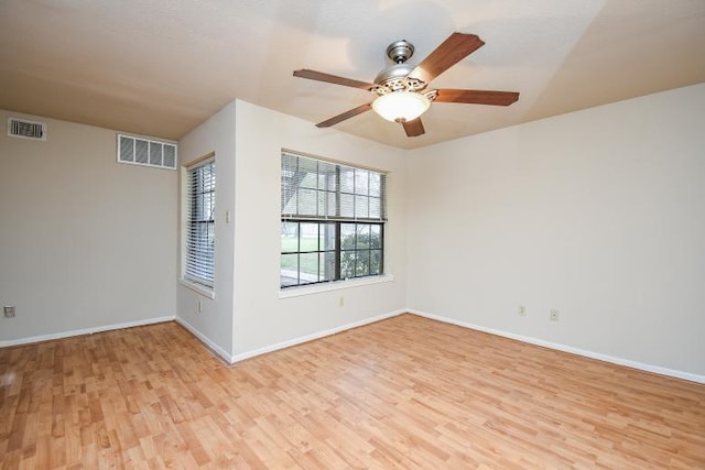 unfurnished room with light hardwood / wood-style flooring and ceiling fan