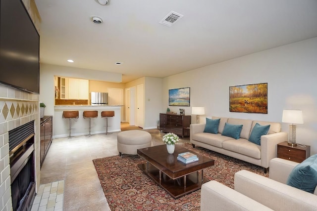 living room featuring a fireplace