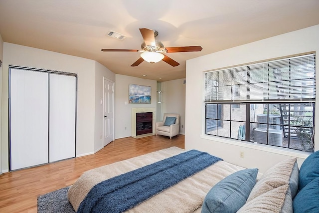 bedroom featuring ceiling fan and light wood-type flooring