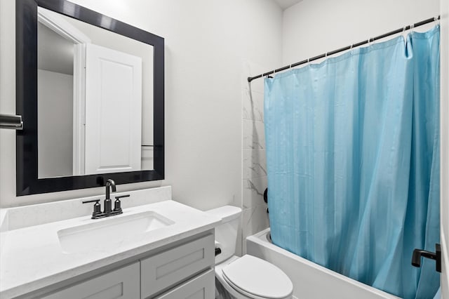 full bathroom with vanity, shower / bath combo, and toilet