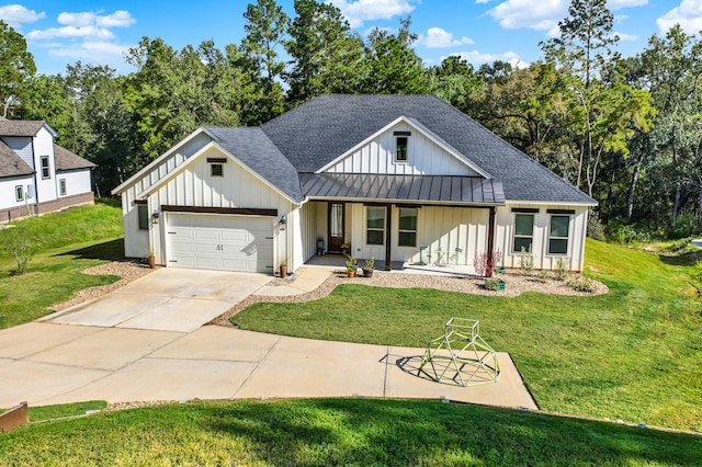 modern farmhouse with a porch, a garage, and a front lawn