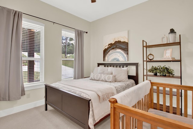 bedroom featuring carpet floors and multiple windows