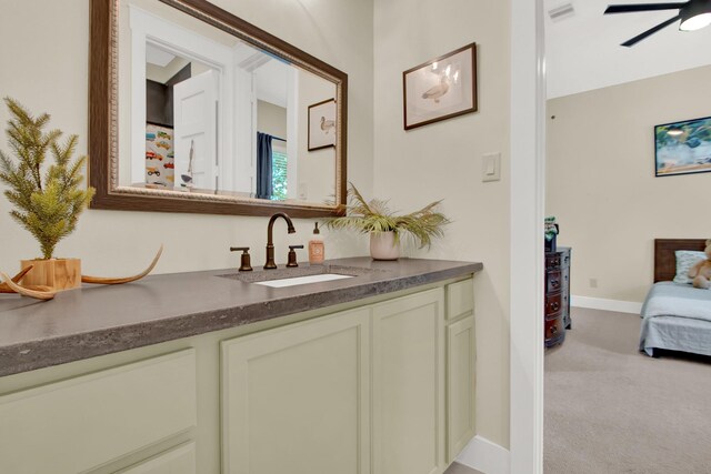 bathroom with ceiling fan and vanity