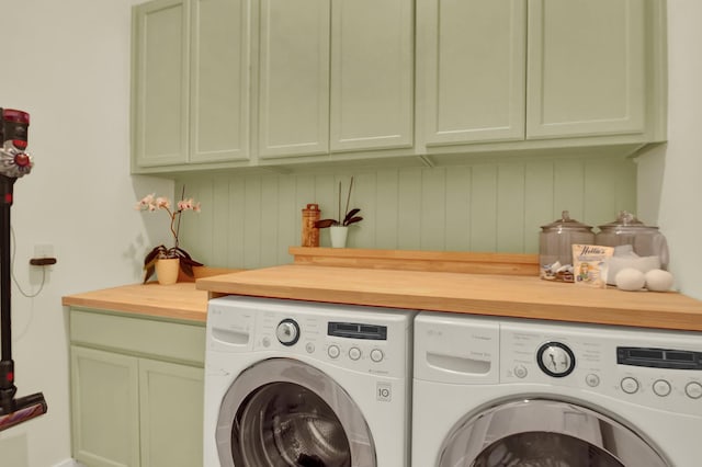 laundry area featuring cabinets and separate washer and dryer