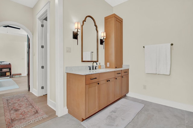 bathroom with vanity and wood-type flooring