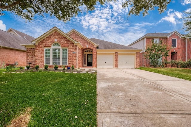 front of property with a front lawn and a garage