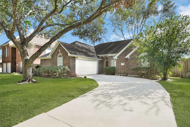 view of front of house with a garage and a front yard