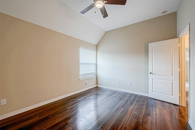 empty room featuring ceiling fan, dark wood-type flooring, and lofted ceiling