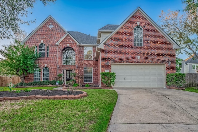 front facade featuring a front lawn and a garage