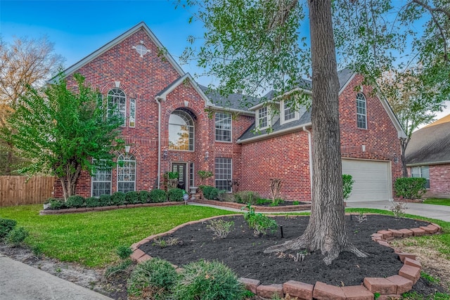 view of front of house with a front lawn and a garage