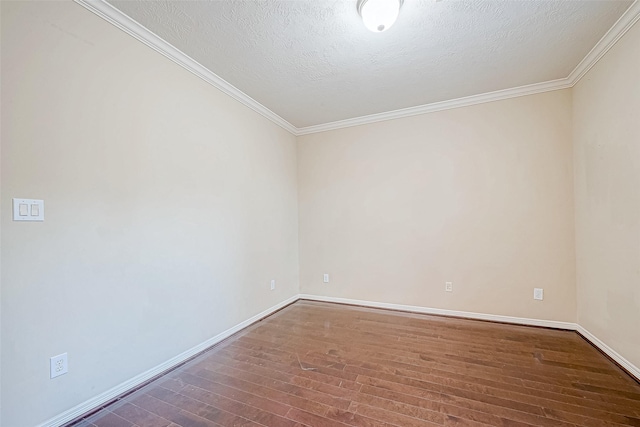 spare room with crown molding, dark wood-type flooring, and a textured ceiling