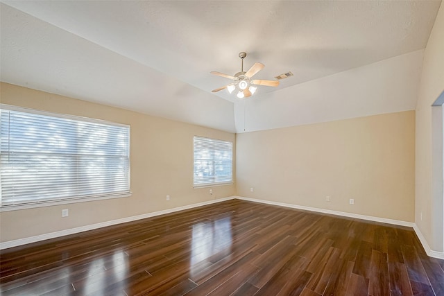 unfurnished room featuring ceiling fan, lofted ceiling, and dark wood-type flooring