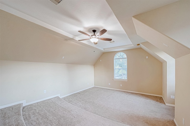 bonus room with ceiling fan, light colored carpet, and lofted ceiling