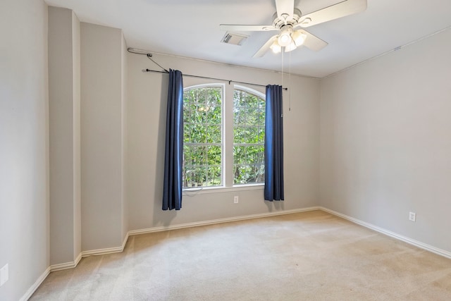 carpeted empty room with ceiling fan