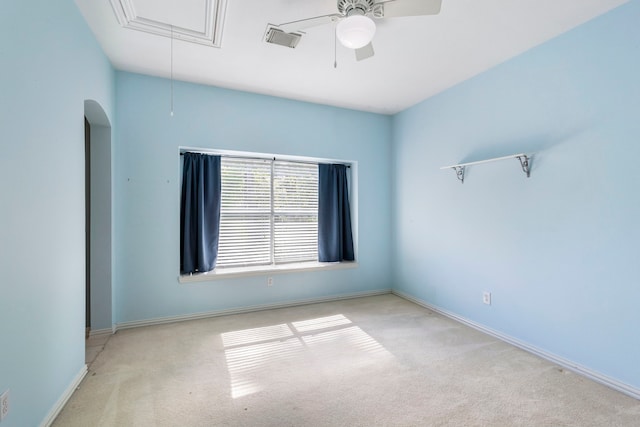 carpeted spare room with ceiling fan