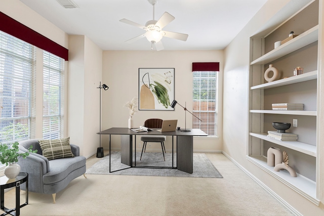 office with ceiling fan and light colored carpet