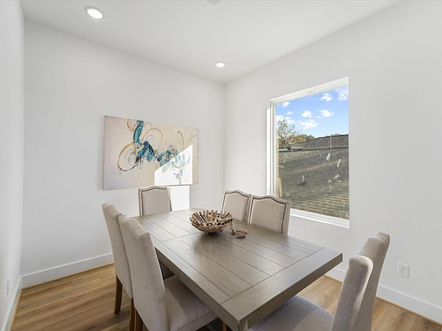 dining area with hardwood / wood-style floors