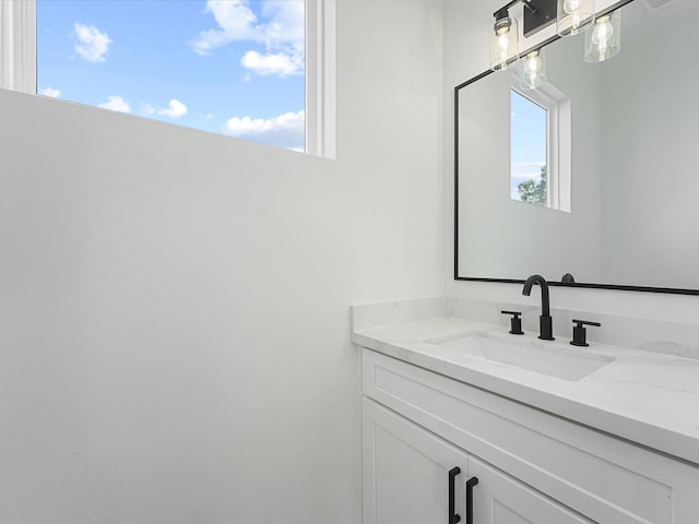 bathroom featuring vanity and plenty of natural light