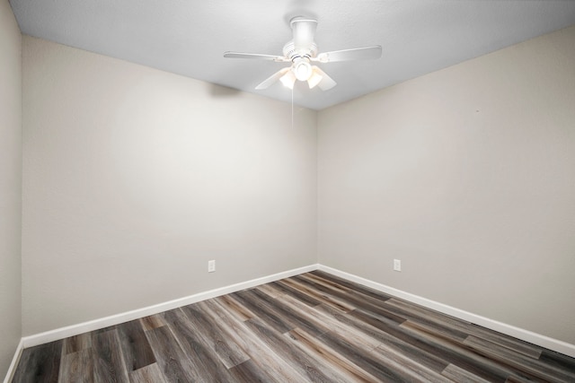 spare room with ceiling fan and dark hardwood / wood-style floors