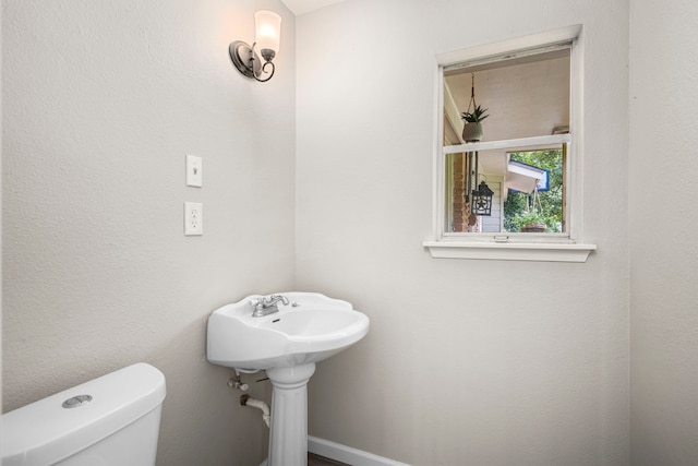 bathroom featuring toilet