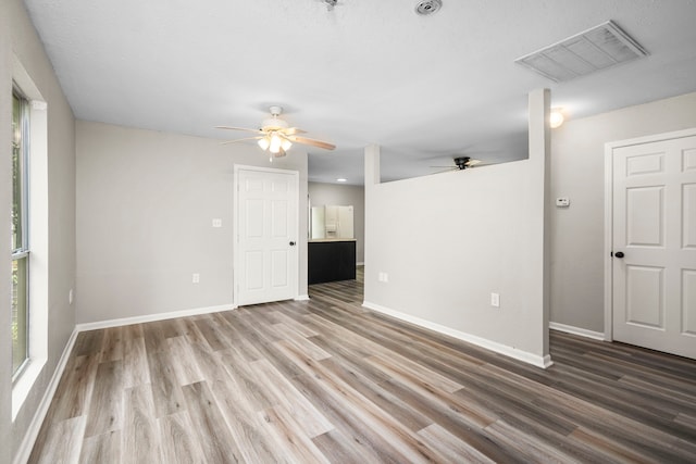 unfurnished room featuring ceiling fan and wood-type flooring