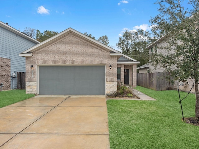 view of front of property with a garage and a front lawn