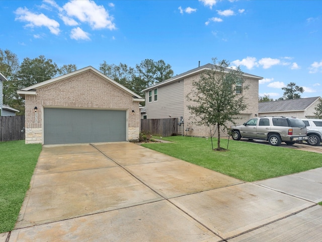 view of front of home featuring a garage and a front lawn