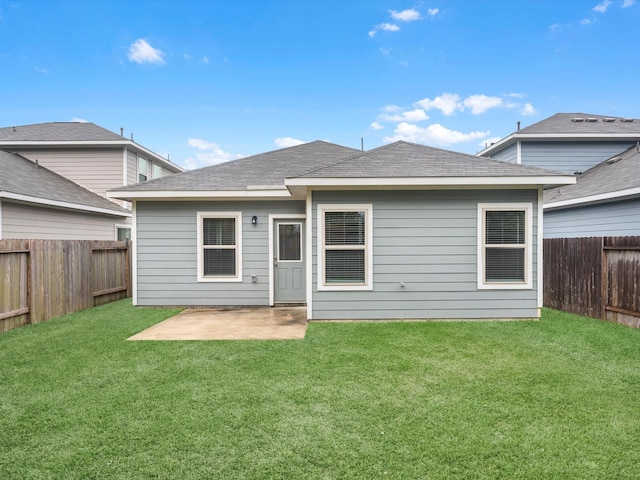 back of house featuring a yard and a patio