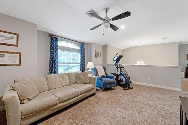 carpeted living room featuring ceiling fan with notable chandelier