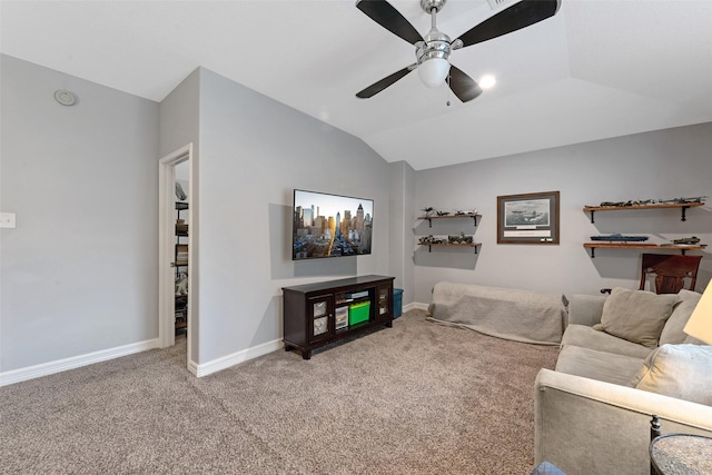 carpeted living room featuring ceiling fan and lofted ceiling