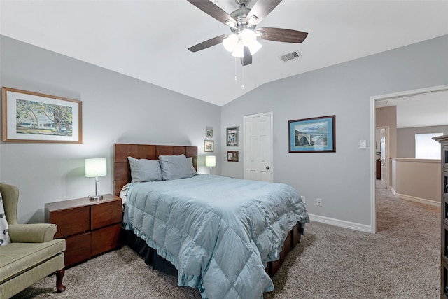 bedroom with light colored carpet, vaulted ceiling, and ceiling fan