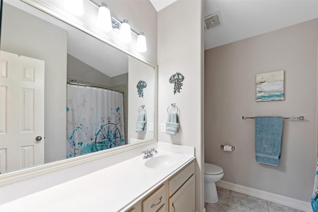 bathroom featuring vanity, lofted ceiling, and toilet