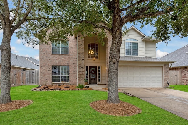 view of front of property with a garage and a front lawn