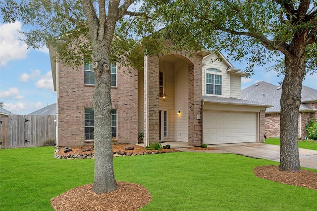 view of front of property with a front yard and a garage