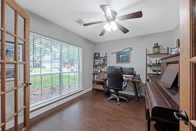 home office with a wealth of natural light, french doors, ceiling fan, and dark hardwood / wood-style floors