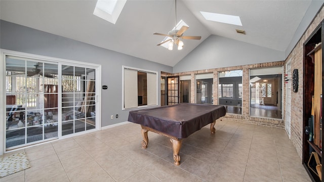 recreation room with tile patterned flooring, ceiling fan, billiards, and a skylight