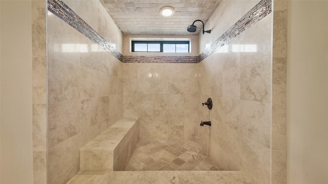 bathroom featuring a tile shower